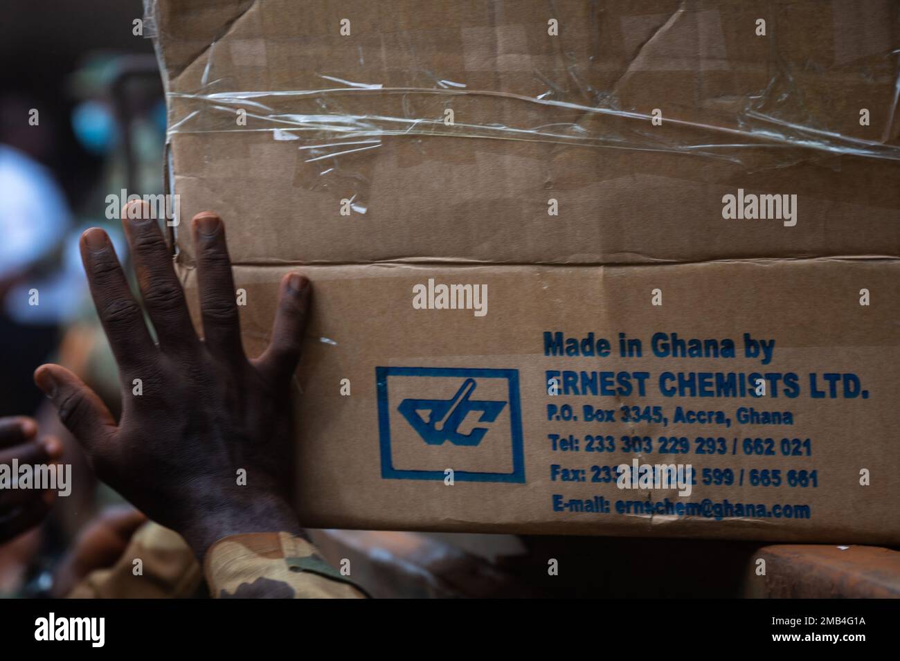 A Ghanaian army solider unloads medical supplies during a medical civic