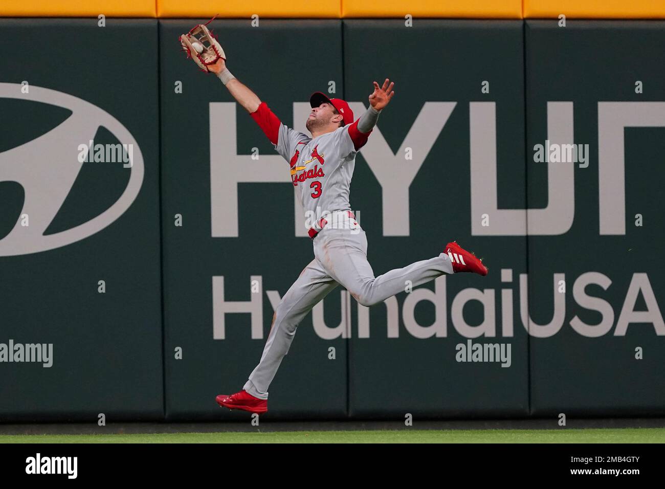 St. Louis Cardinals outfielder Dylan Carlson catches a fly ball by