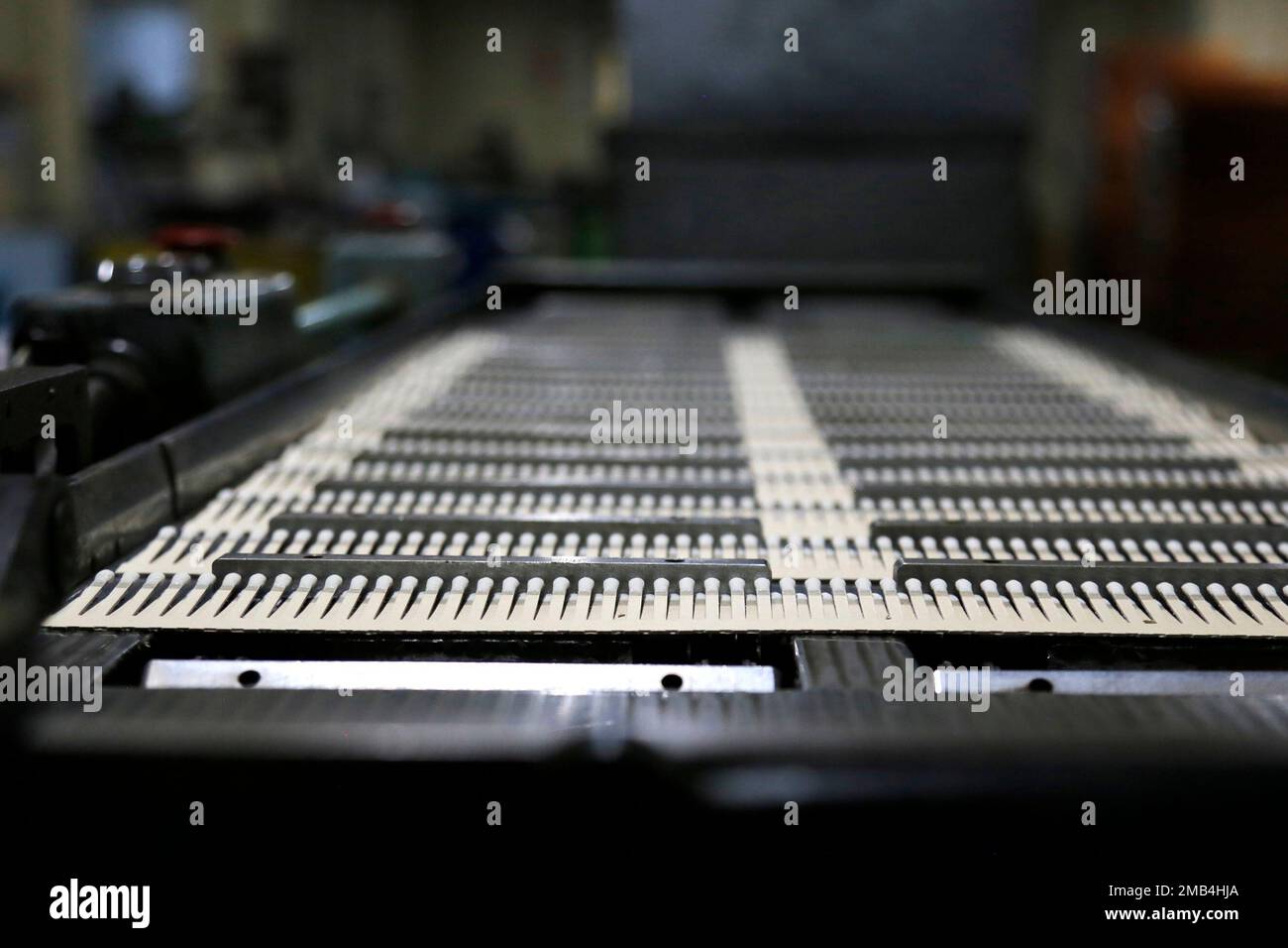 Parts of matchbooks roll off an assembly line at a Nittosha factory in