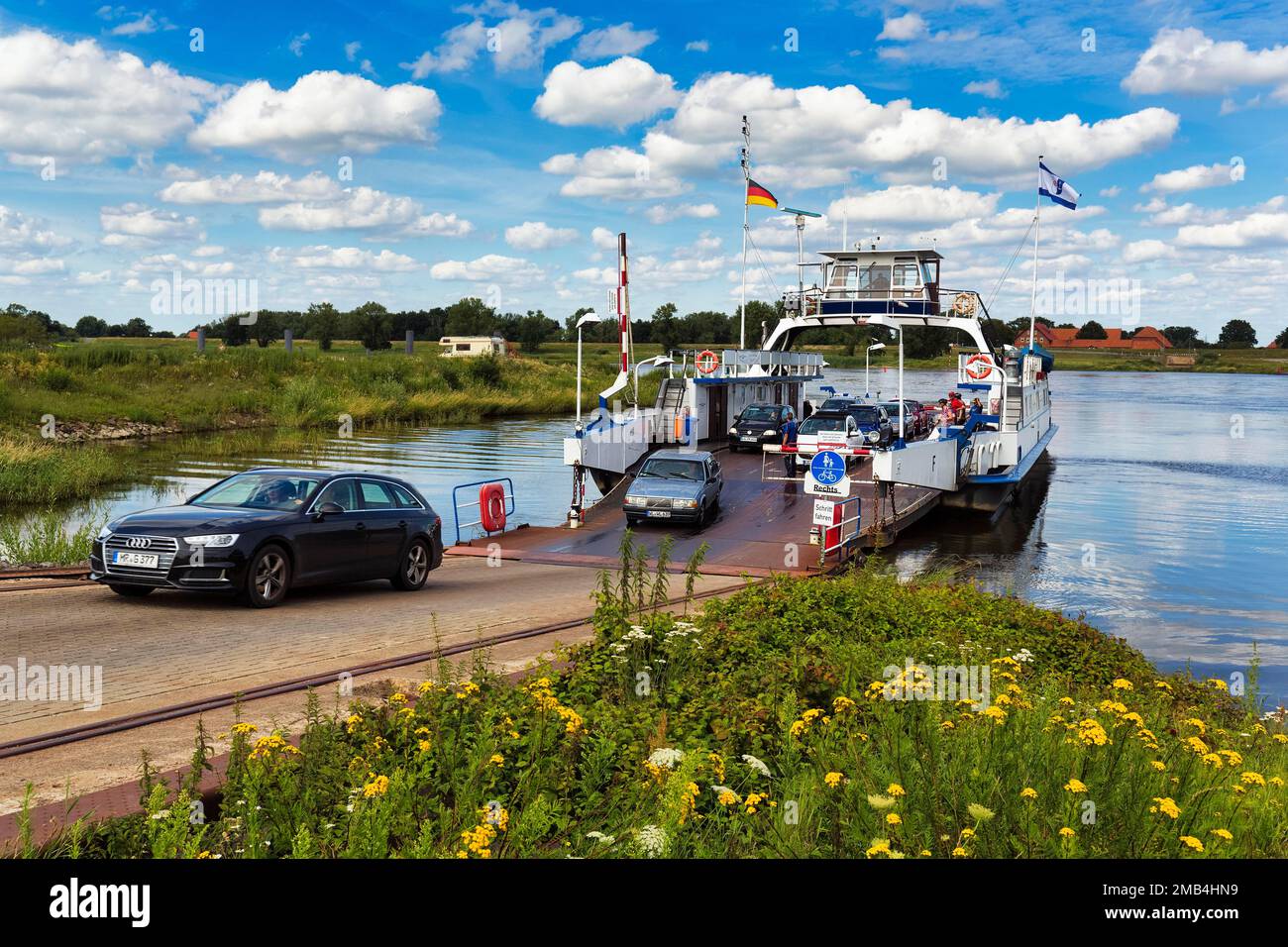 Cars drive off ferry, Elbfaehre, Neu Darchau, Luechow-Dannenberg, Elbtalaue, Lower Saxony, Germany Stock Photo