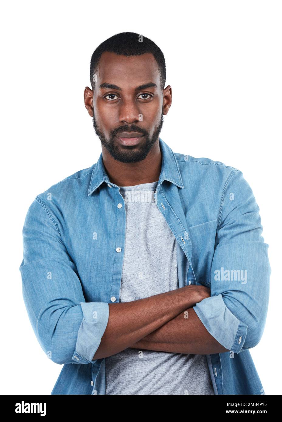 Portrait of black man with confidence, serious and isolated on white background in denim shirt. Casual fashion, trendy startup owner and person in Stock Photo