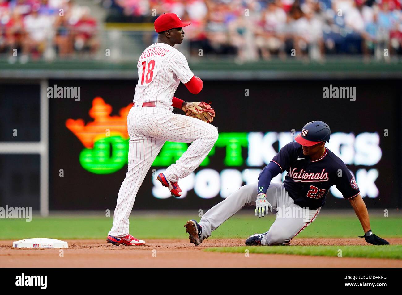 St. Petersburg, FL USA: Philadelphia Phillies shortstop Didi Gregorius (18)  throws to first for the out during a spring training baseball game against  the Tampa Bay Rays, Wednesday, April 6, 2022, at