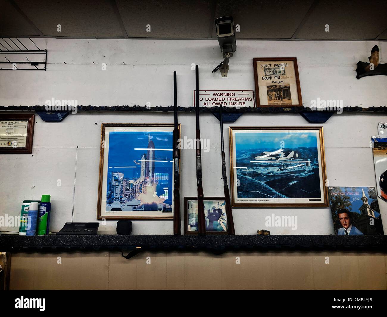 Guns are on display at Mike's Pawn shop in Moulton, Ala., on Friday