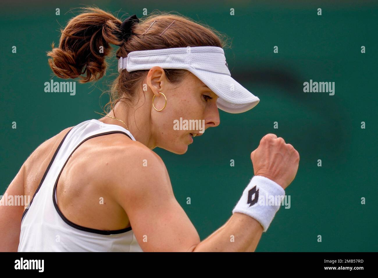 France's Alize celebrates winning a point against Australia's