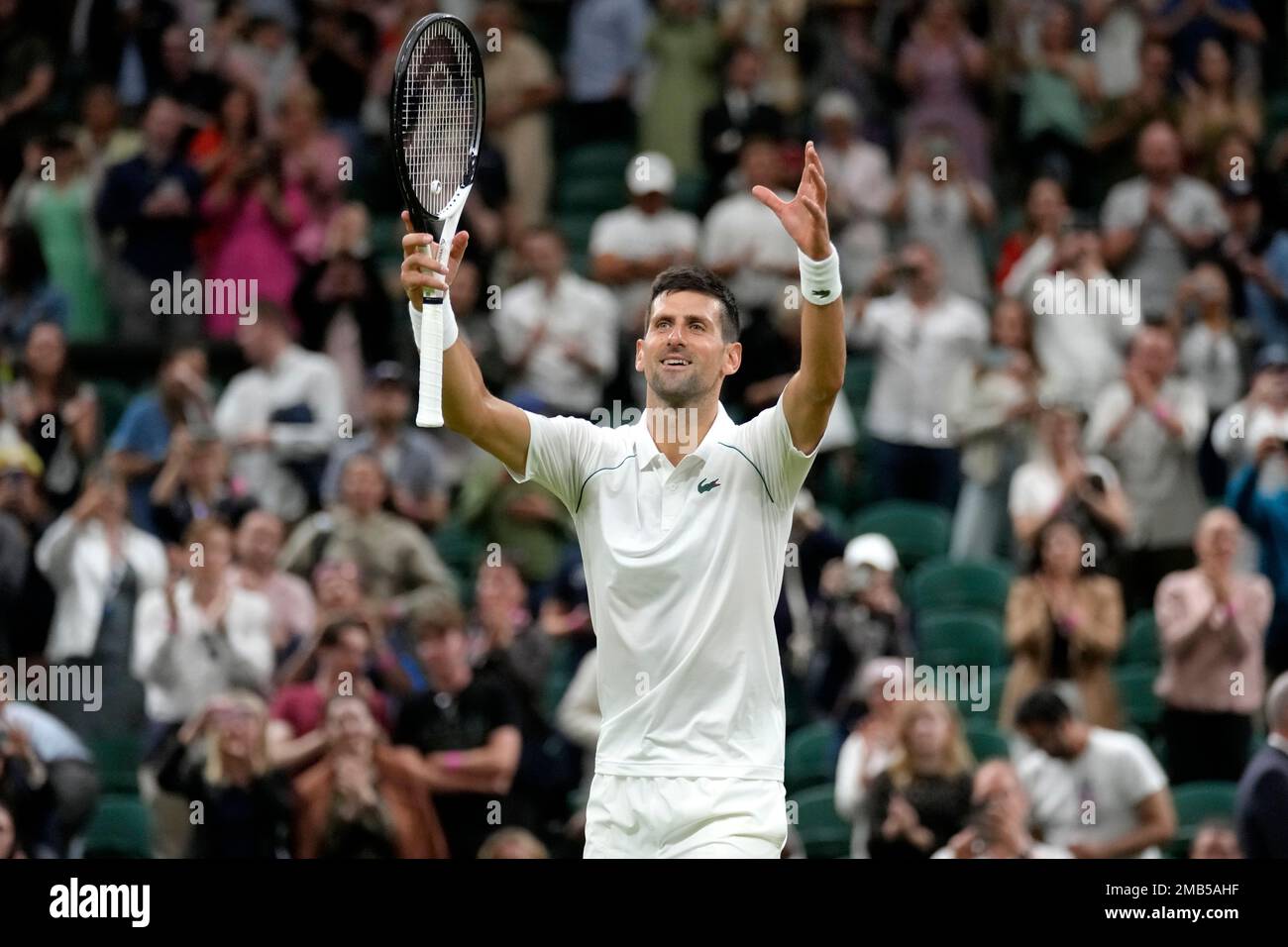 Serbias Novak Djokovic celebrates defeating Tim van Rijthoven of the Netherlands during a mens fourth round singles match on day seven of the Wimbledon tennis championships in London, Sunday, July 3, 2022.(AP