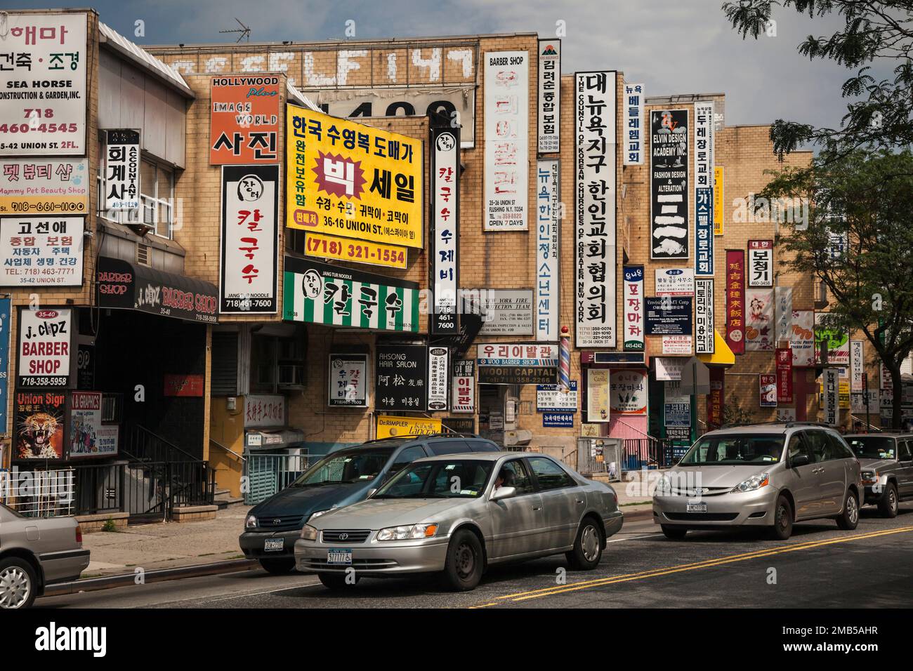 Street covered by Oriental signs in Flushing neighborhood, Queens, New