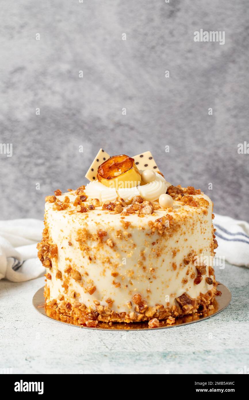 Honey and hazelnut cake on a stone background. Fruit and nut birthday