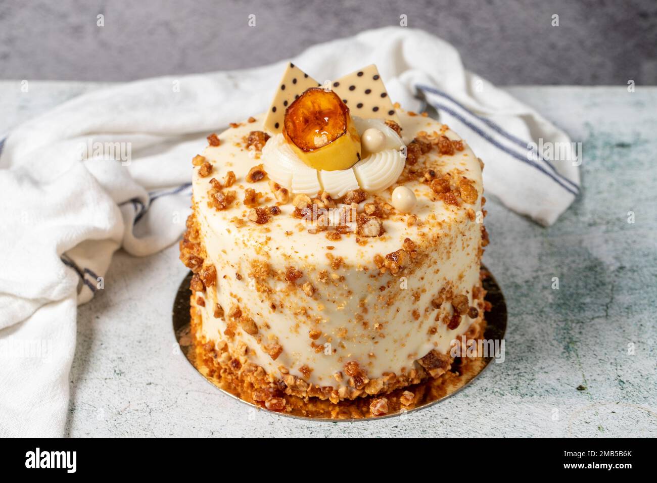 Honey and hazelnut cake on a stone background. Fruit and nut birthday