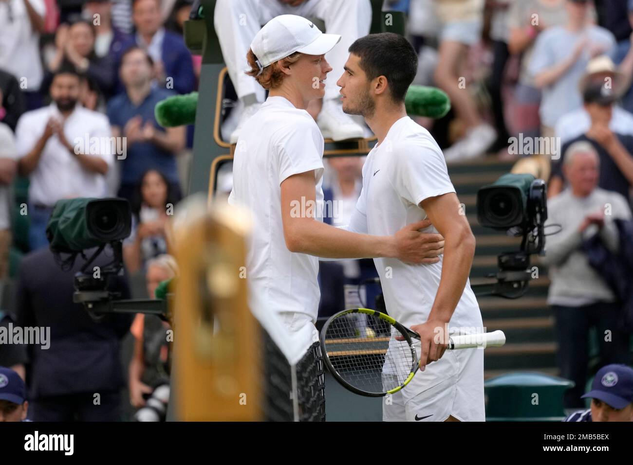 Italys Jannik Sinner hugs Spains Carlos Alcaraz after defeating him a mens fourth round singles match on day seven of the Wimbledon tennis championships in London, Sunday, July 3, 2022.(AP Photo/Kirsty Wigglesworth