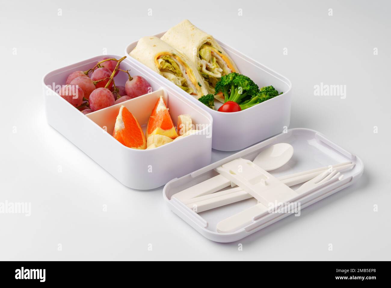 Lunch boxes with healthy food isolated on white Stock Photo - Alamy