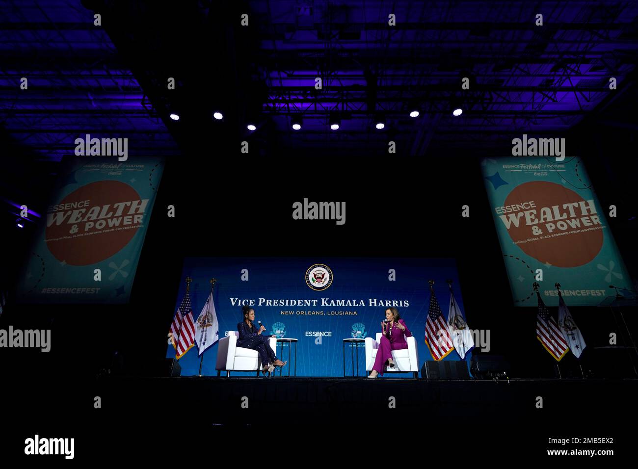 Vice President Kamala Harris speaks with actress Keke Palmer, left, at