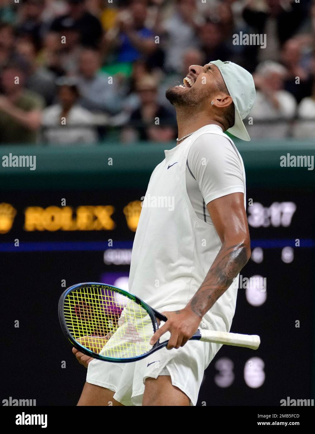 Australias Nick Kyrgios celebrates beating Greeces Stefanos Tsitsipas during their third round mens singles match on day six of the Wimbledon tennis championships in London, Saturday, July 2, 2022