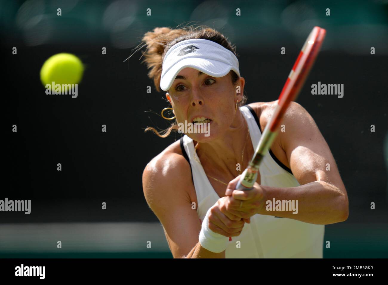 Frances Alize Cornet returns the ball to Polands Iga Swiatek during a third round womens singles match on day six of the Wimbledon tennis championships in London, Saturday, July 2, 2022