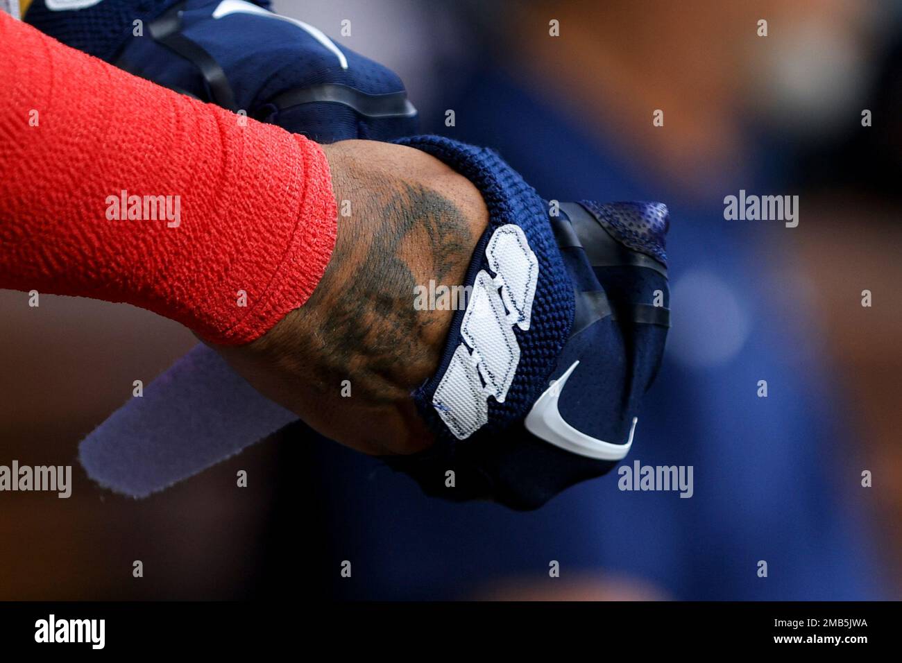 Atlanta Braves' Ronald Acuna Jr. puts on his Nike batting gloves in the  dugout during a baseball game against the Cincinnati Reds in Cincinnati,  Friday, July 1, 2022. The Braves won 9-1. (