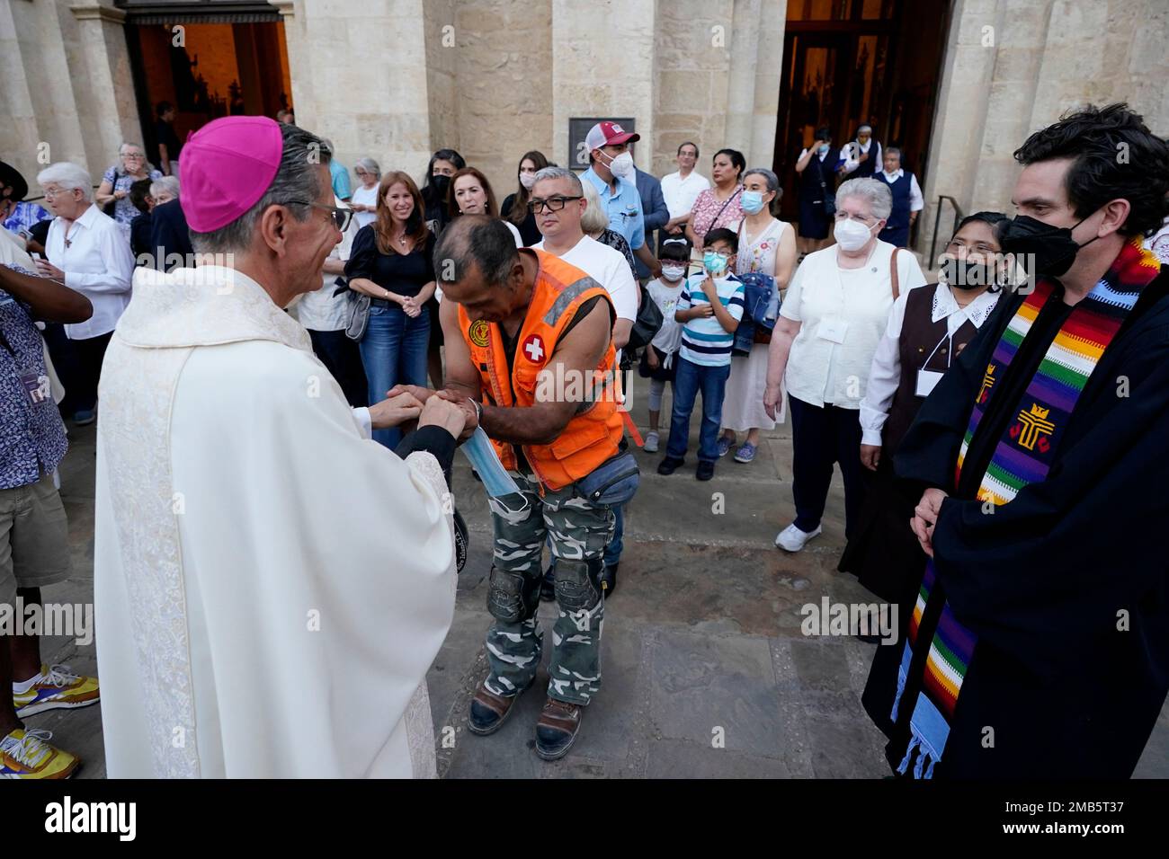 Jose Prin, center, a migrant from Venezuela, is greeted by(02)