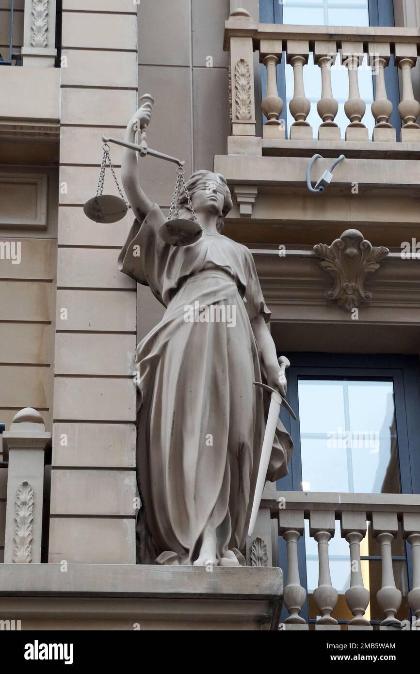 Statue of the ancient Greek goddess of justice Themis with scales and a