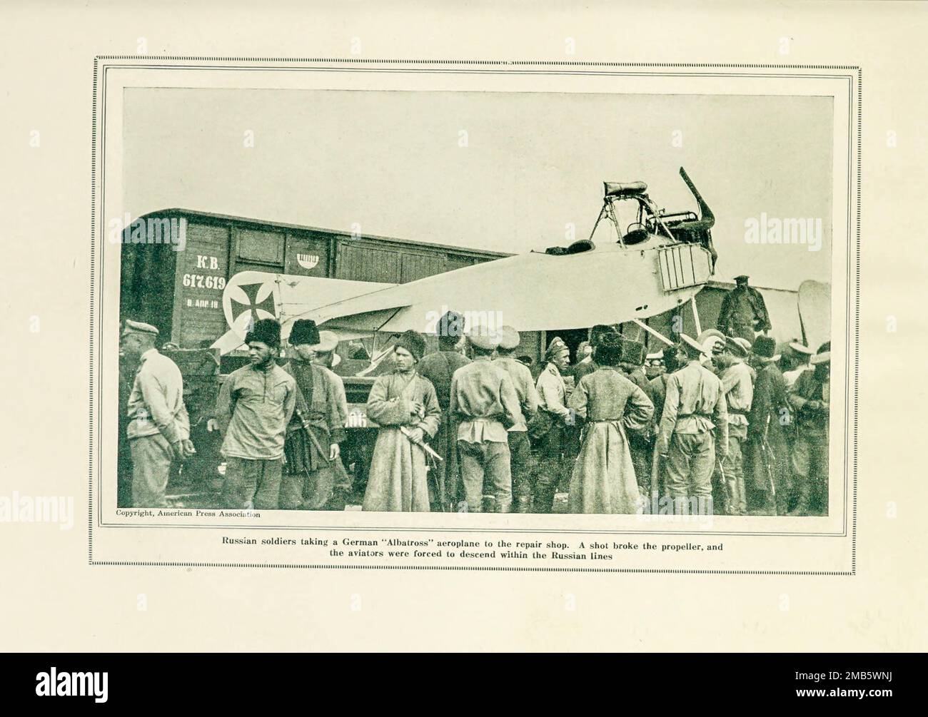 Russians Removing a Captured German Aeroplane from the book The story of the great war; the complete historical records of events to date DIPLOMATIC AND STATE PAPERS by Reynolds, Francis Joseph, 1867-1937; Churchill, Allen Leon; Miller, Francis Trevelyan, 1877-1959; Wood, Leonard, 1860-1927; Knight, Austin Melvin, 1854-1927; Palmer, Frederick, 1873-1958; Simonds, Frank Herbert, 1878-; Ruhl, Arthur Brown, 1876-  Volume VIII Published 1920 Stock Photo