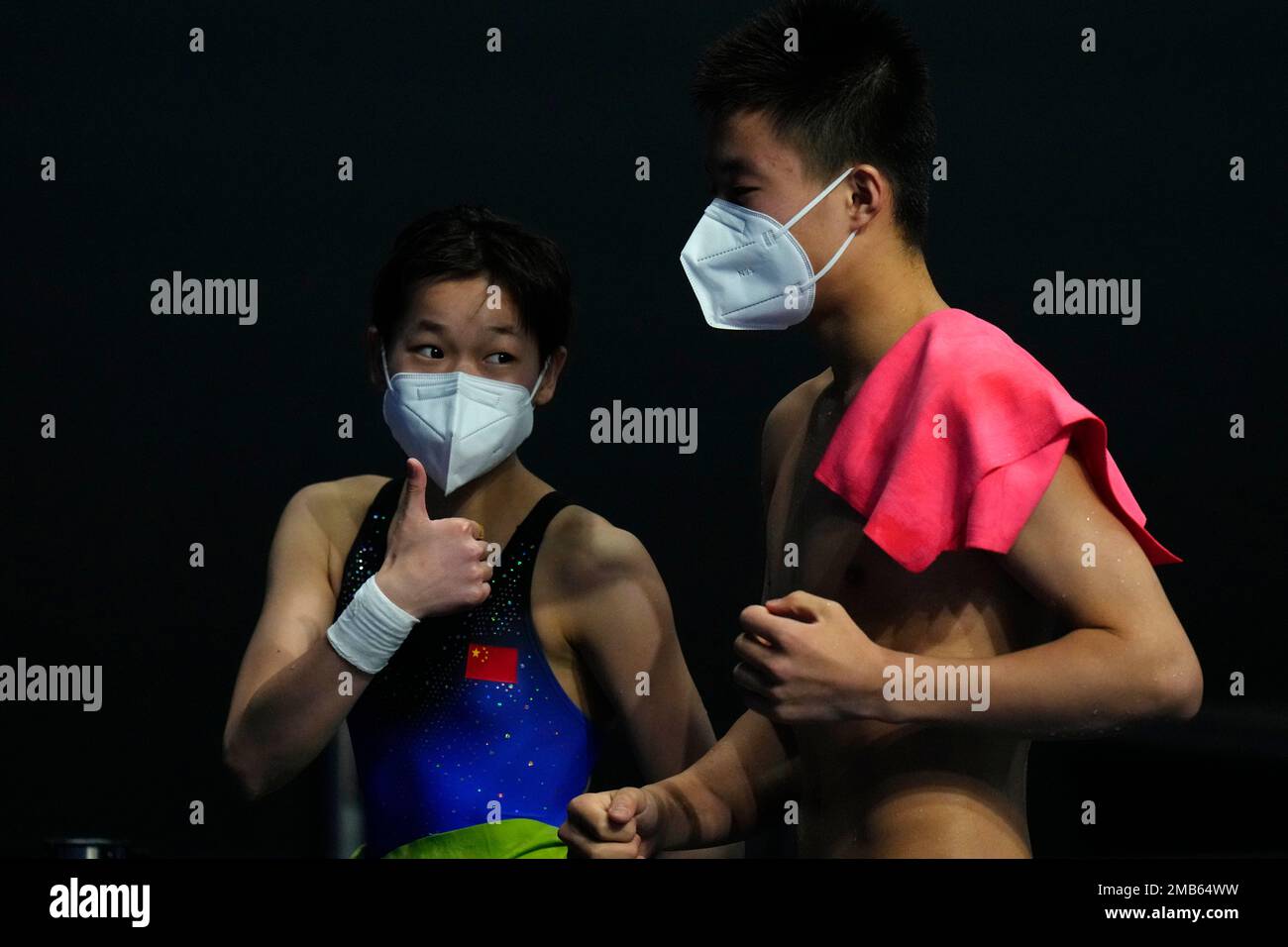 Quan Hongchan, left, and Bai Yuming of team China celebrate after
