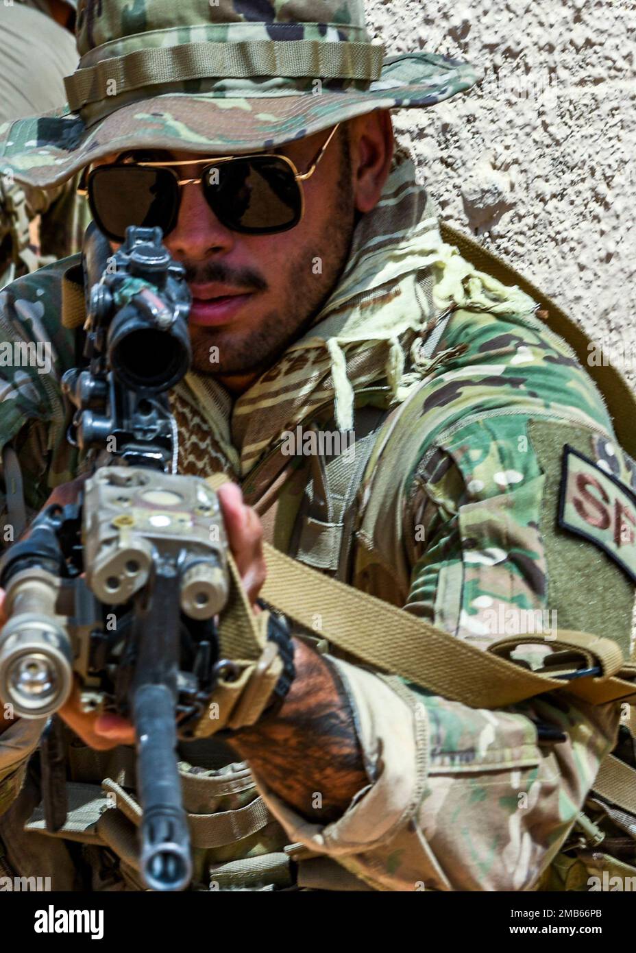U.S. Air Force Staff Sgt. Alejandro Bachelier,  assigned to the 378th Expeditionary Security Forces Squadron, holds security for Royal Saudi Land Force soldiers and U.S. Soldiers assigned to Task Force Hurricane, during a training exercise in Al-Kharj, Kingdom of Saudi Arabia, June 12, 2022. Eight USAF Defenders were invited by the U.S. Army to attend Task Force Hurricane’s platoon immersion course alongside the Royal Saudi Land Force. The immersion allowed the 378th ESFS members a chance to develop as multi-capable Airmen by learning both Joint Force infantry tactics and Partner Nation infant Stock Photo