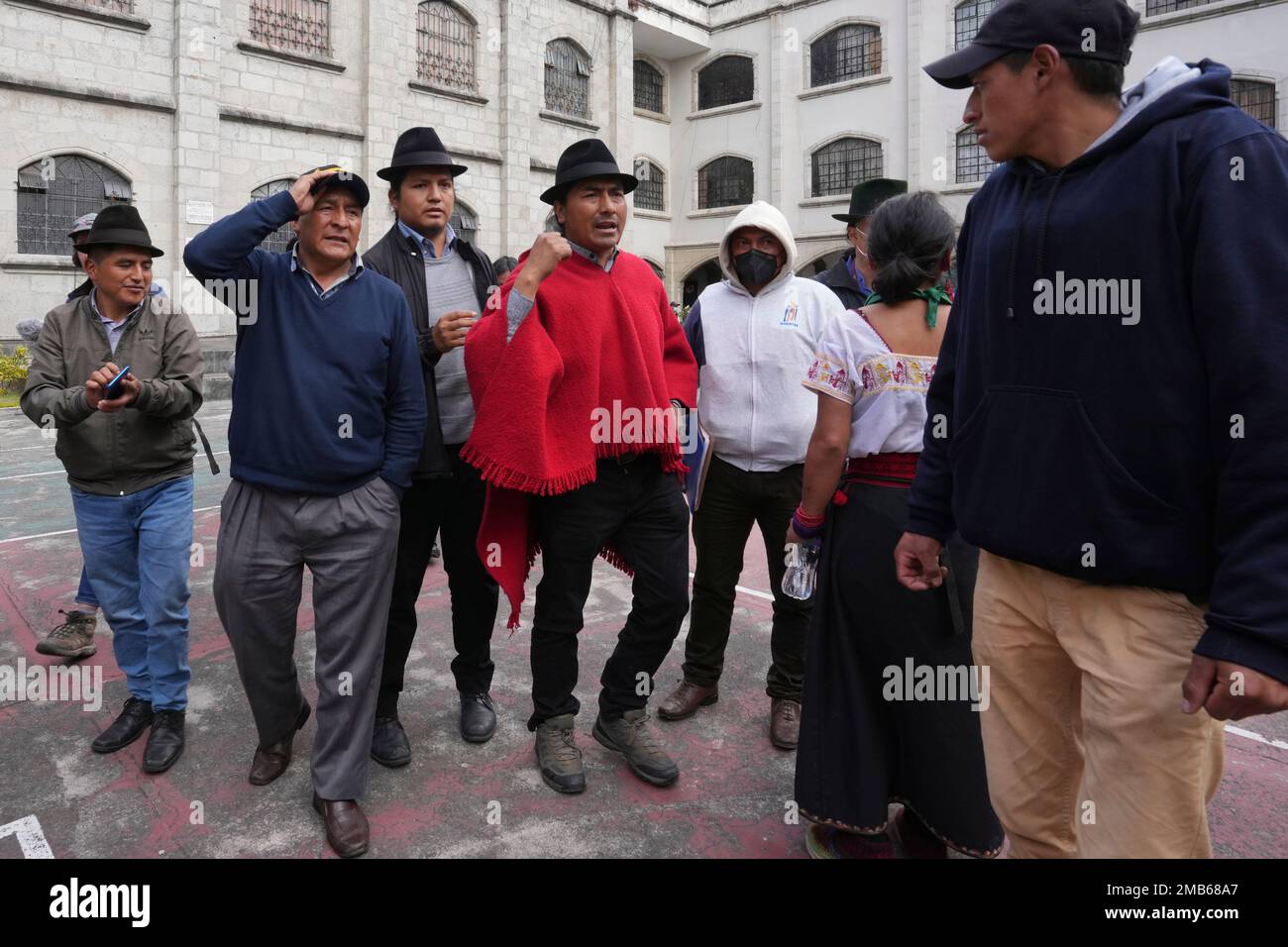 Indigenous leader Leonidas Iza, center right, waits with members of his