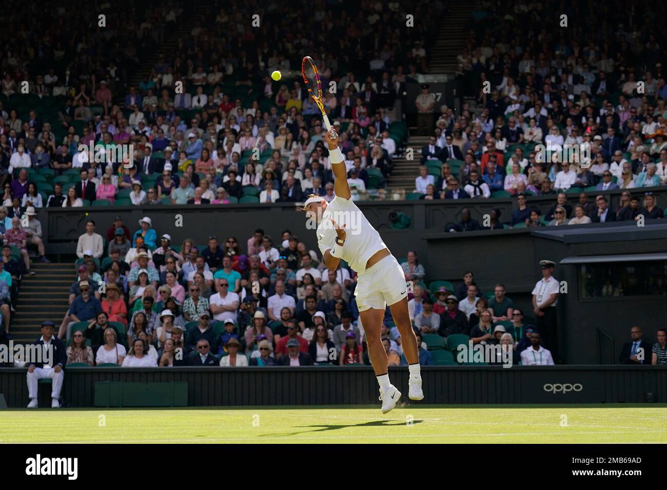 Spain's Rafael Nadal serves to Argentina's Francisco Cerundolo in a first  round men's singles match on day two of the Wimbledon tennis championships  in London, Tuesday, June 28, 2022. (AP Photo/Alberto Pezzali