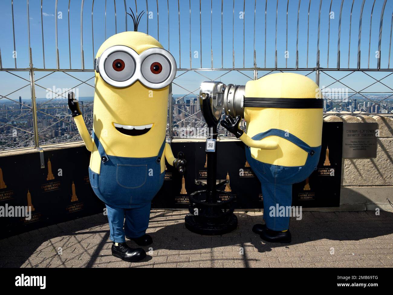 Minion characters Kevin, left, and Bob pose on the 86th floor ...