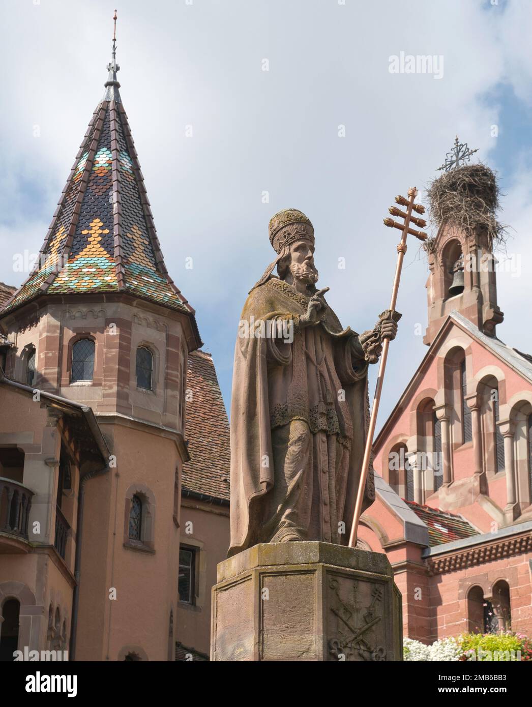 Saint-Léon (Pope Leo 1)  statue and fountain in Saint-Léon Square,Place du Chateau, Eguisheim, Alsace, France Stock Photo