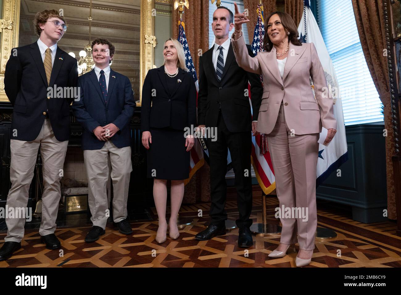 Vice President Kamala Harris, right, takes a photograph with Ambassador Bridget Brink and her family, from left, sons Jack Higgins, Cole Higgins, Brink, and husband Nicholas Higgins, after Brink was ceremonially sworn in as Ambassador to Ukraine, in the Vice President's Ceremonial office, Monday, June 27, 2022, at the Eisenhower Executive Office Building on the White House complex in Washington. (AP Photo/Jacquelyn Martin) Stock Photo