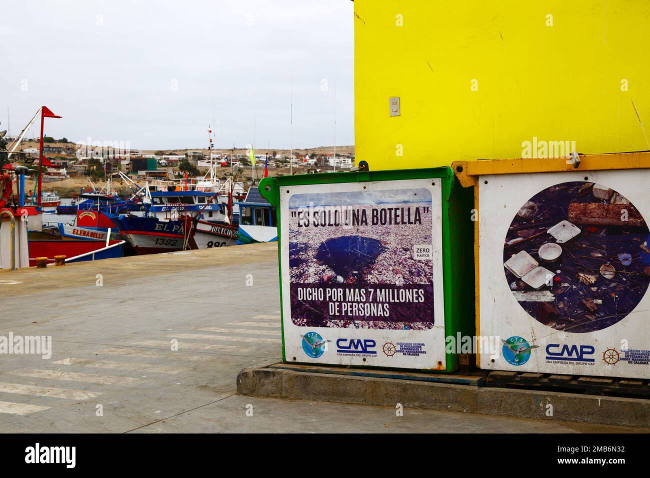 Sign in fishing docks encouraging people and fishermen not to throw plastic bottles into the sea, Caldera, Region III, Chile. The Spanish translates as 'It's only one bottle, said more than 7 million people'. Stock Photo