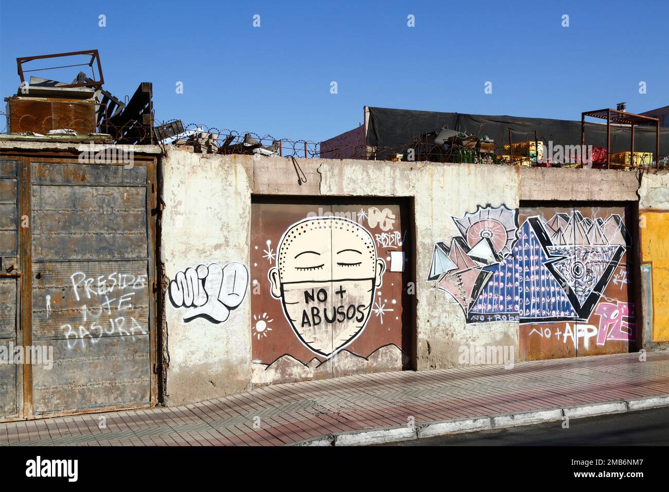 'No More Abuse' mural / graffiti protesting against domestic violence and violence against women on door of house, Copiapo, Region III, Chile Stock Photo