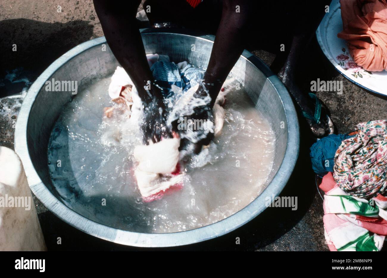 Juma Sudan Close Up Of Sudanese Local Washing Clothes In Bowl Of Water Juma Sudan Close Up Of Sudanese Local Washing Clothes In Bowl Of Water