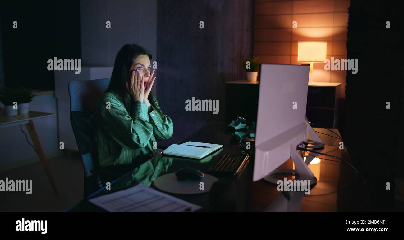 Frustrated Businesswoman Looking At Her Computer Screen In Dismay Stock Photo