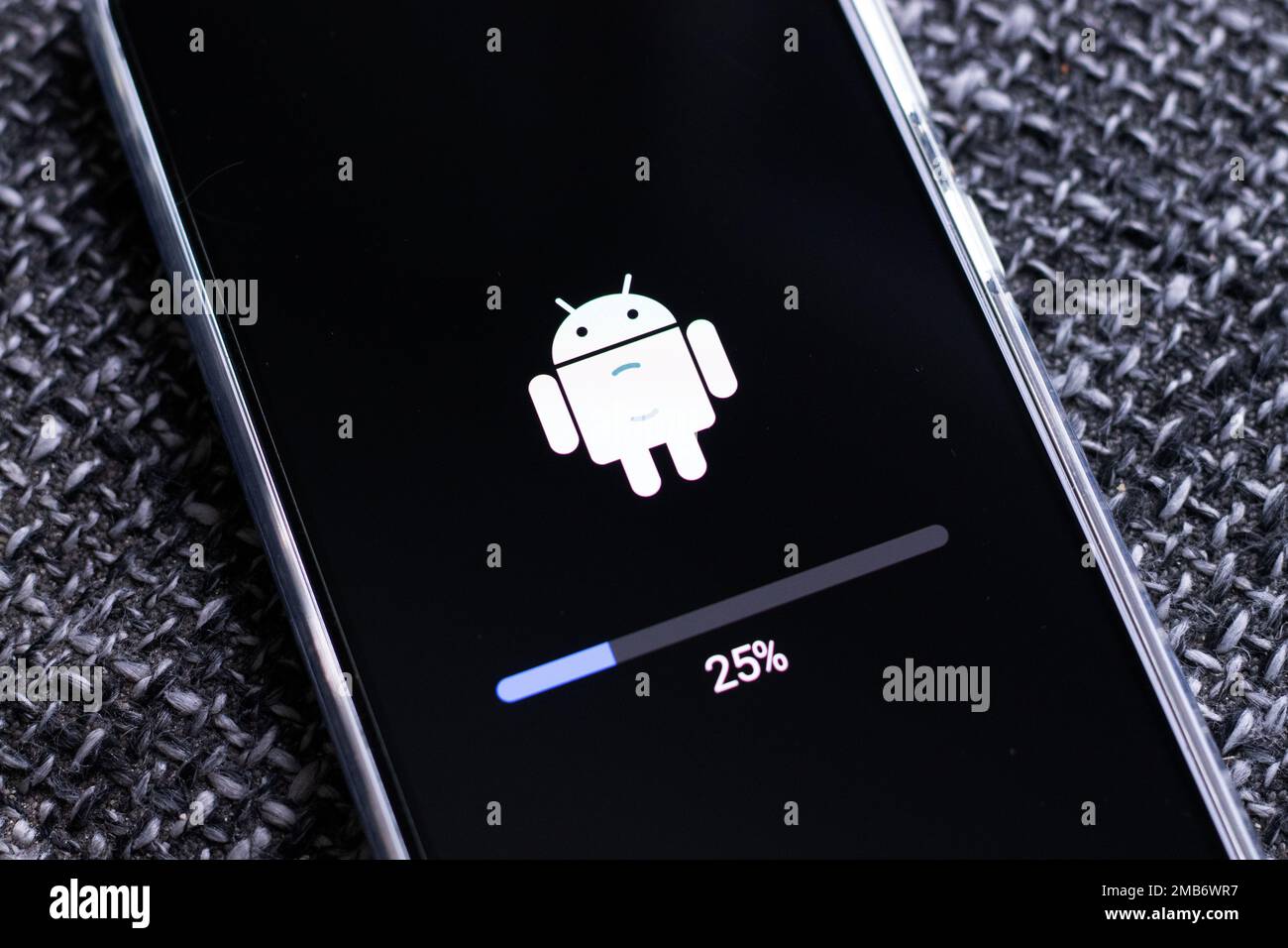Android mobile phone during system update Stock Photo