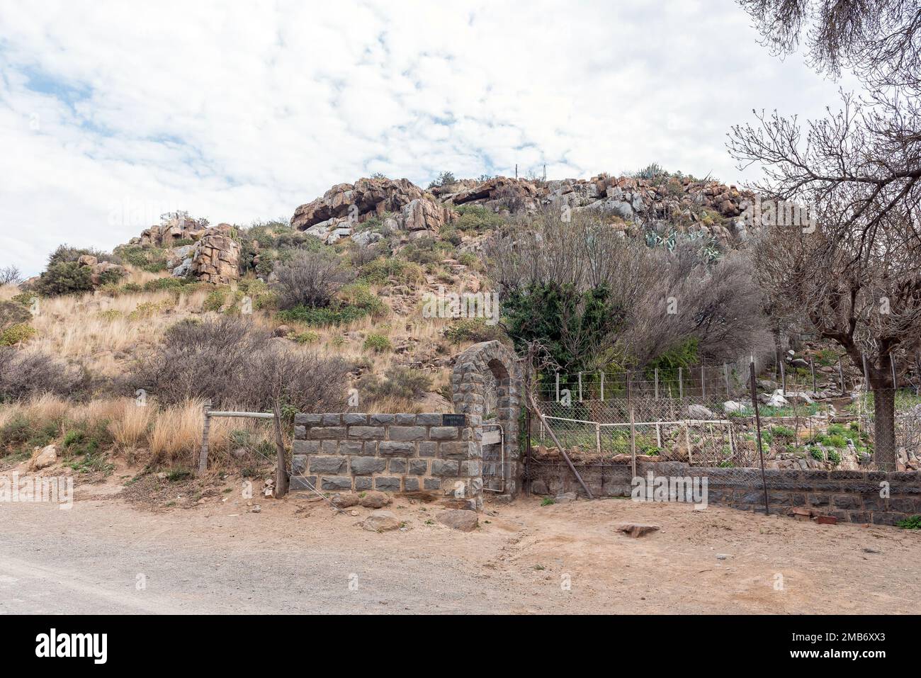 Start of the trail up Trappieskop, a hill in Hanover in the Northern Cape A stone wall with arch