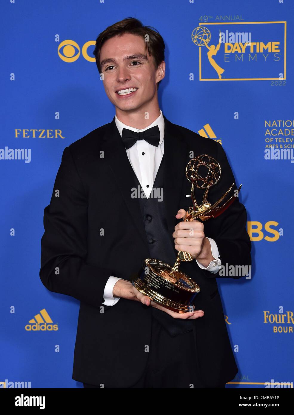 Nicholas Chavez poses in the press room with the award for outstanding