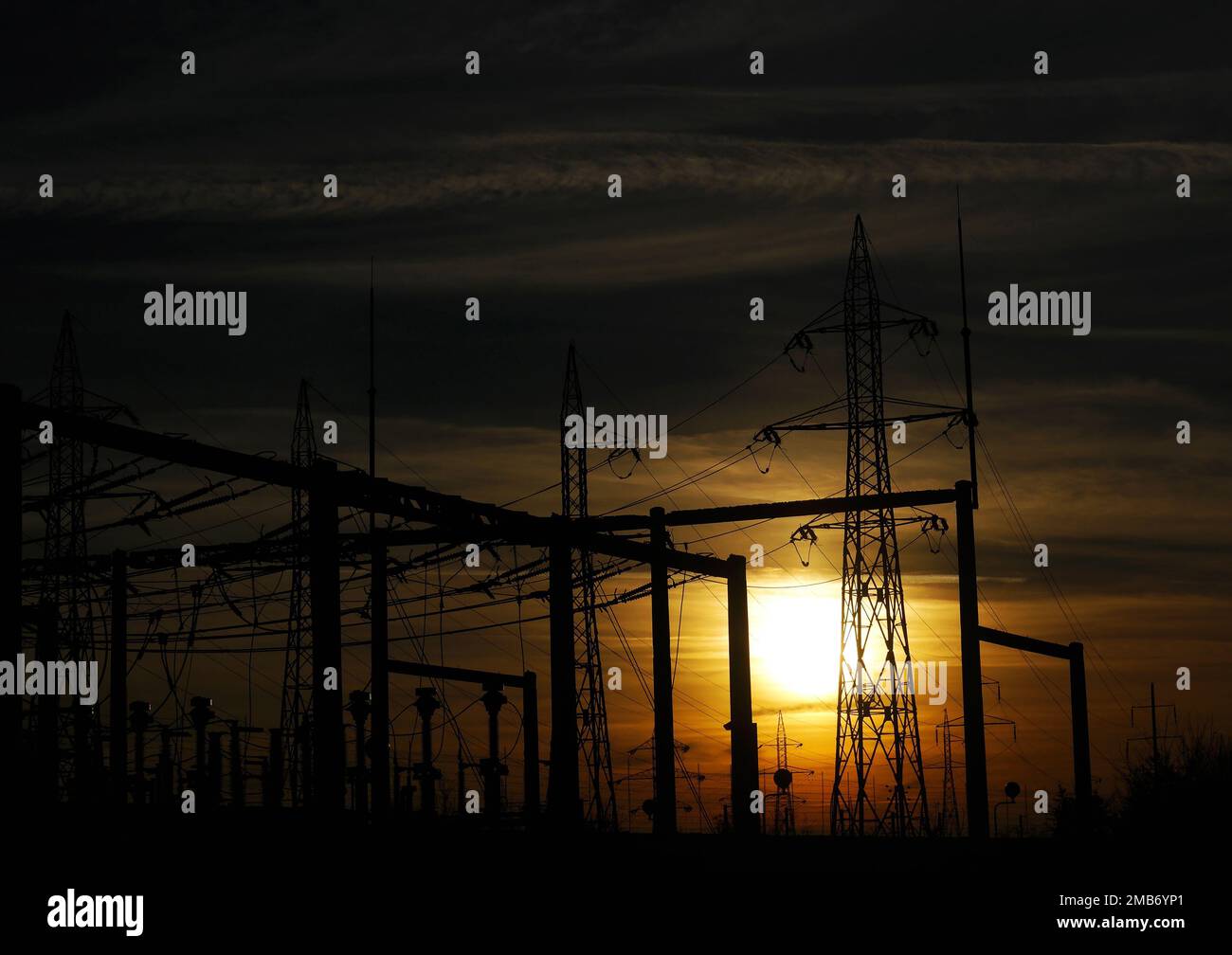 some Power lines against sunset sky Stock Photo - Alamy