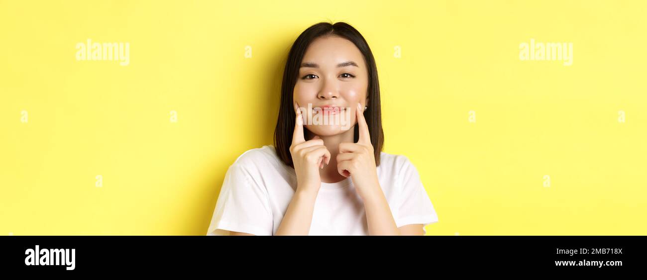 Beauty and skincare. Close up of young asian woman with short dark hair ...
