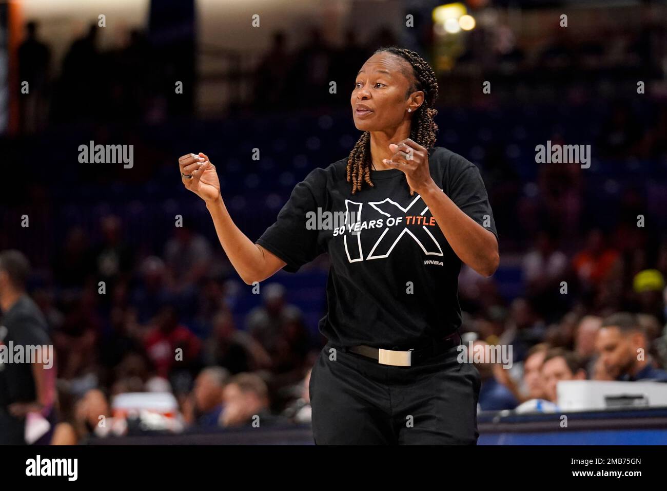 Dallas Wings head coach Vickie Johnson watches play against the Indiana Fever in a WNBA