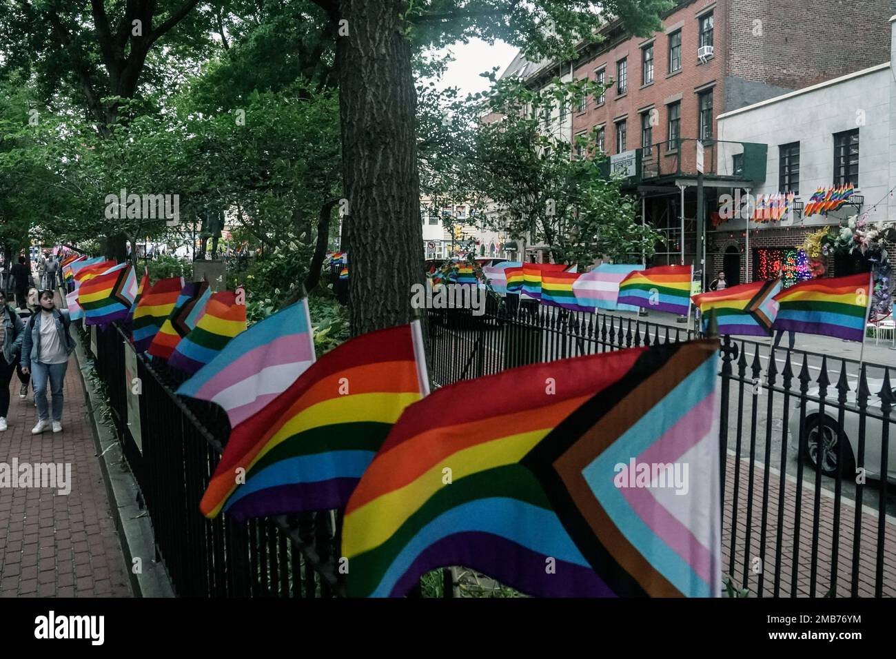 Flags affirming LGBTQ identity dress the fencing surrounding the Stonewall National Monument