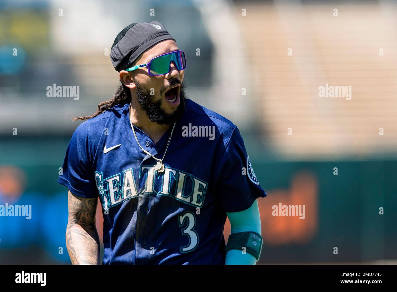 Seattle Mariners' J.P. Crawford reacts after grounding out with runners on  first and second to end the top of the eighth inning of the team's baseball  game against the Oakland Athletics in