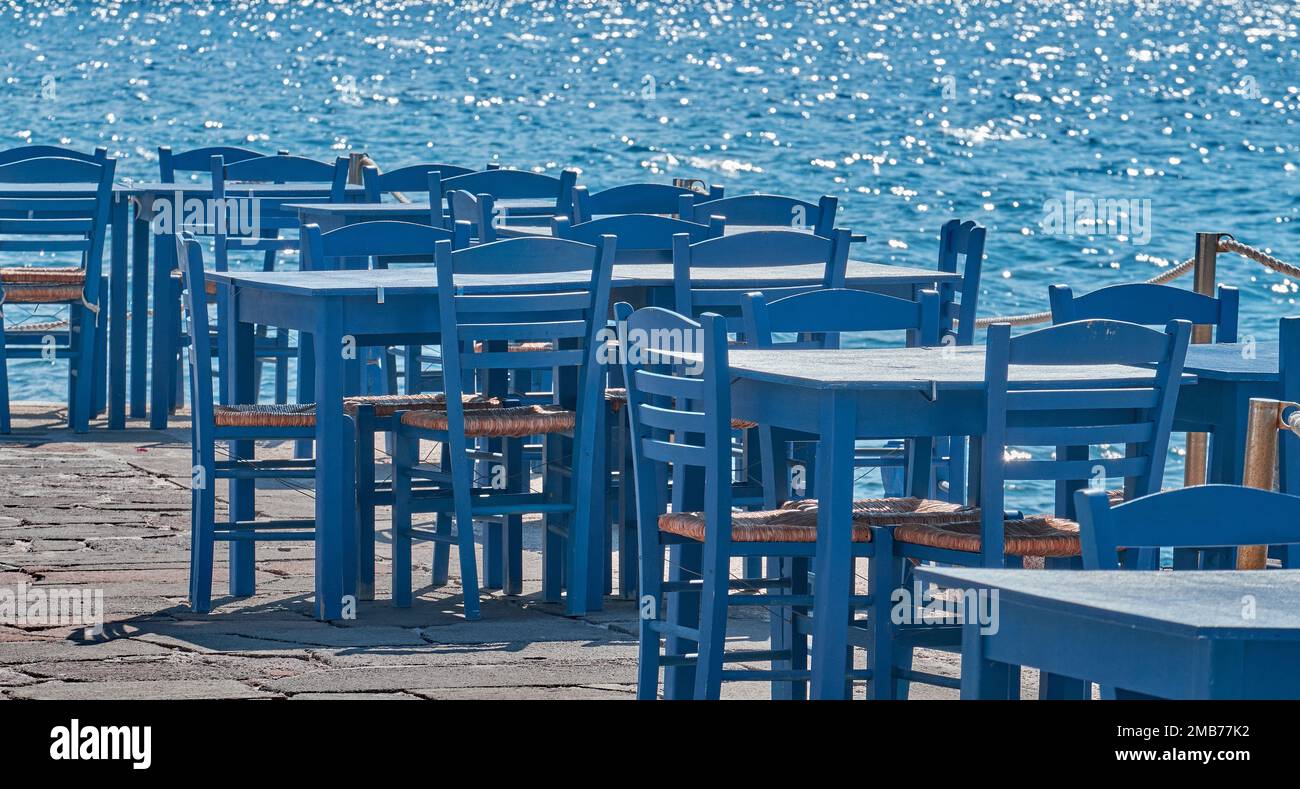 Waiting for tourists, table and chairs of a taverna, Peloponnese, Greece Stock Photo