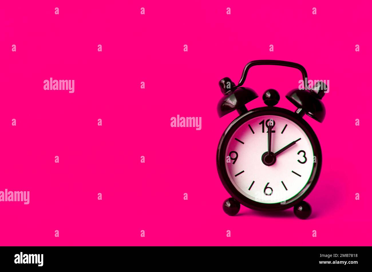 Alarm clock pointing at 2 am or pm with customizable space for text or