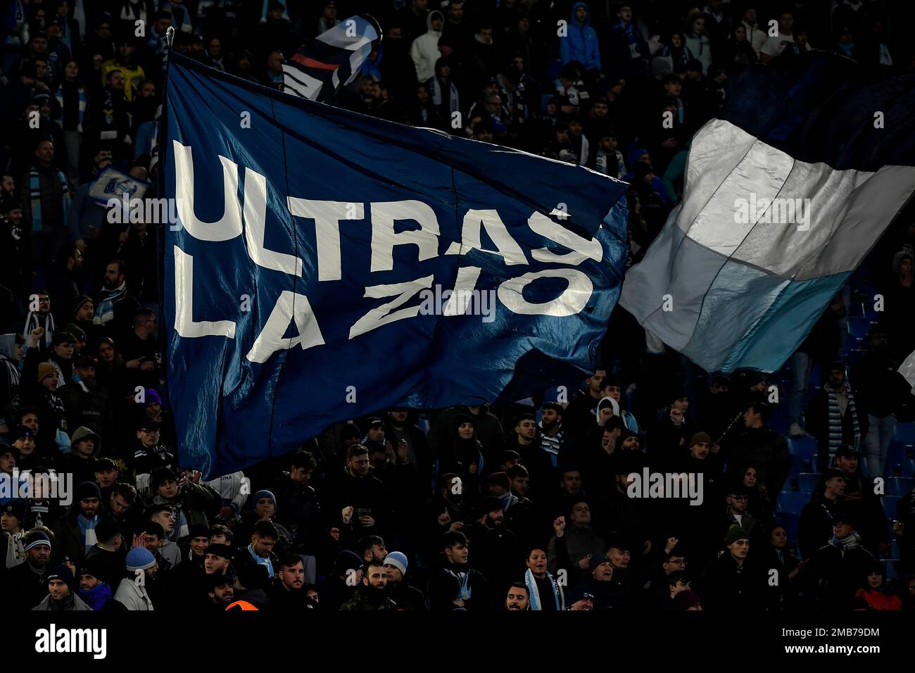 Lazio fans wave a flag with Ultras Lazio written on it during the Italy Cup football match between SS Lazio and Bologna FC at Olimpico stadium in Rome Stock Photo