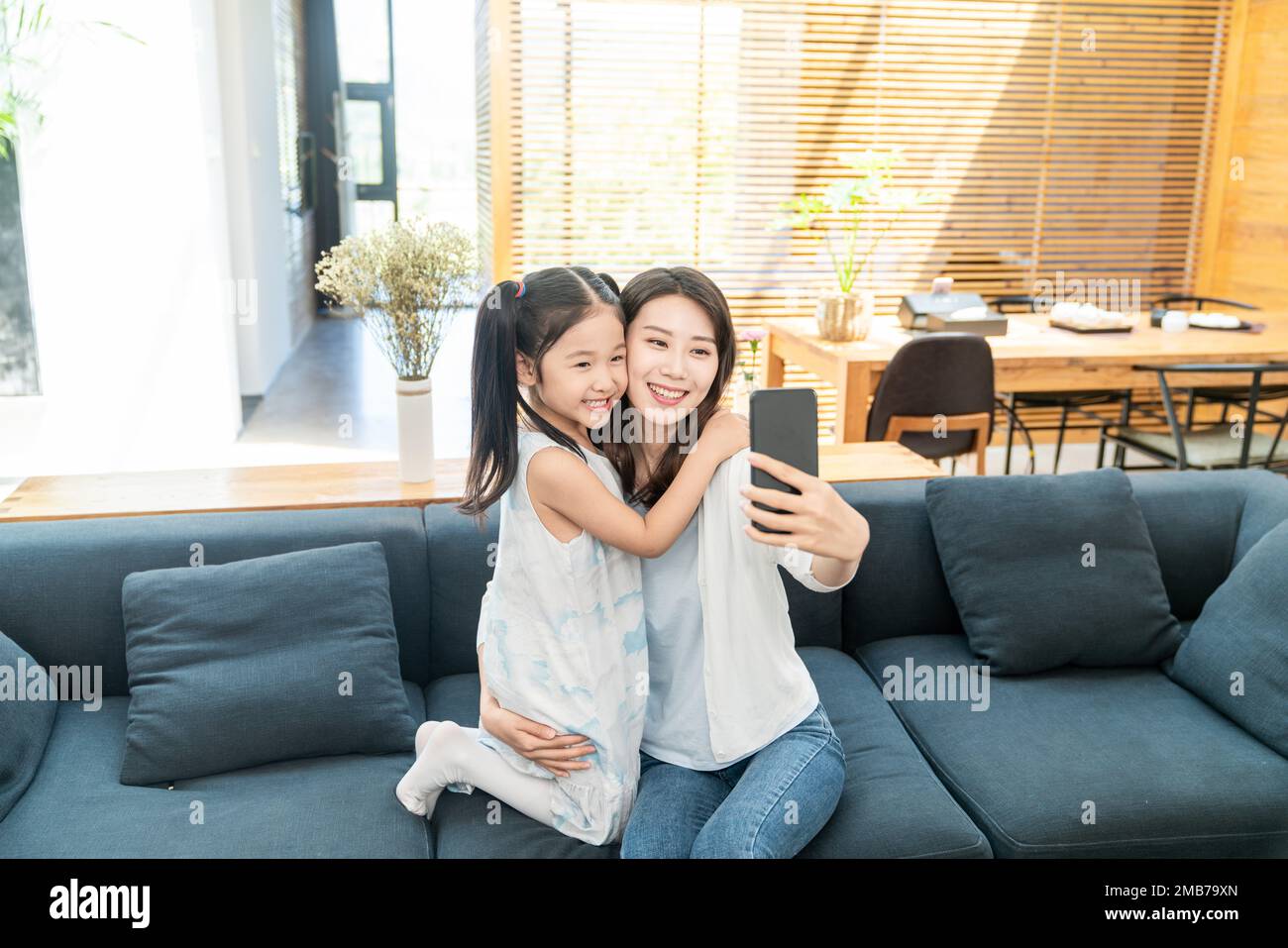 Mother and daughter two people in the living room Stock Photo Alamy