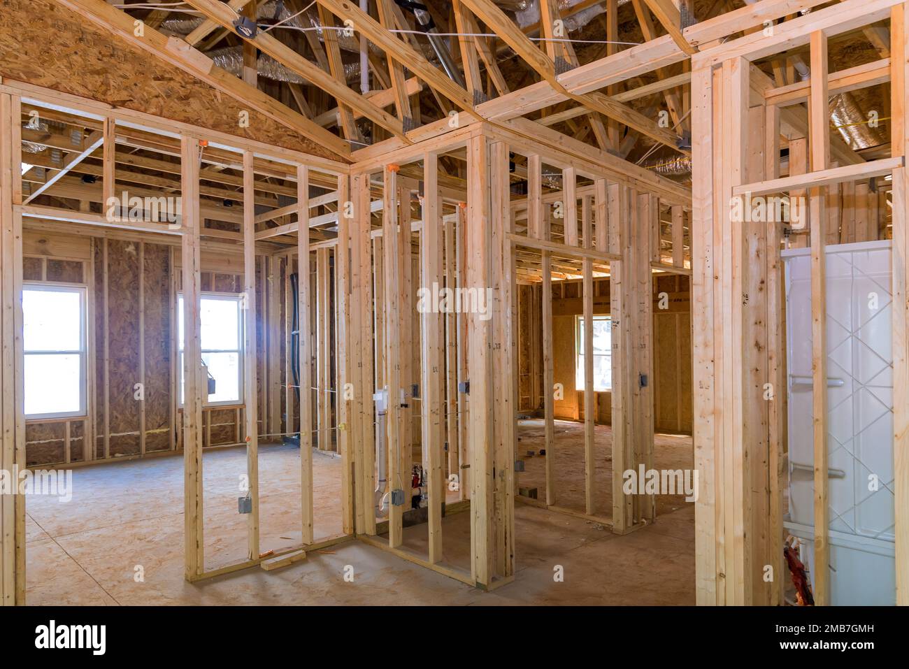 House framing beams form framework for unfinished wood frame of residential construction Stock Photo