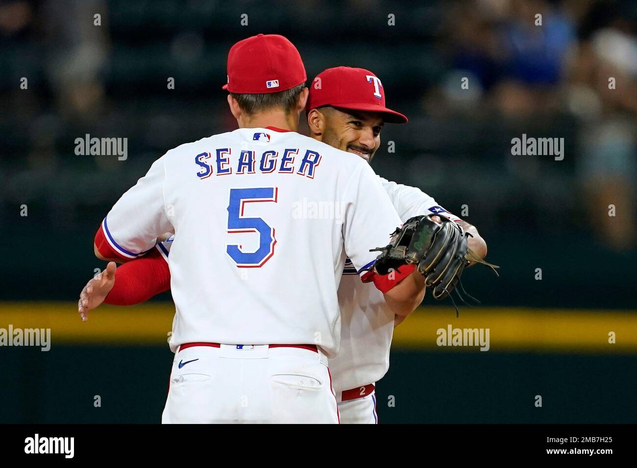 Texas Rangers' Corey Seager (5) and Marcus Semien, right, celebrate their  7-0 win in a baseball game against the Philadelphia Phillies, Tuesday, June  21, 2022, in Arlington, Texas. (AP Photo/Tony Gutierrez Stock Photo - Alamy
