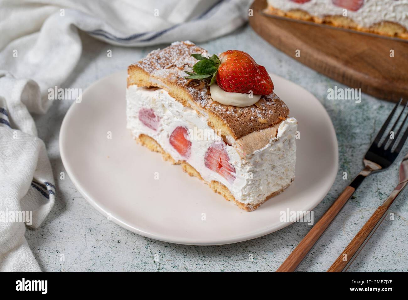 Strawberry and whipped cream cake. Strawberry and cream layer cake on plate. close up Stock