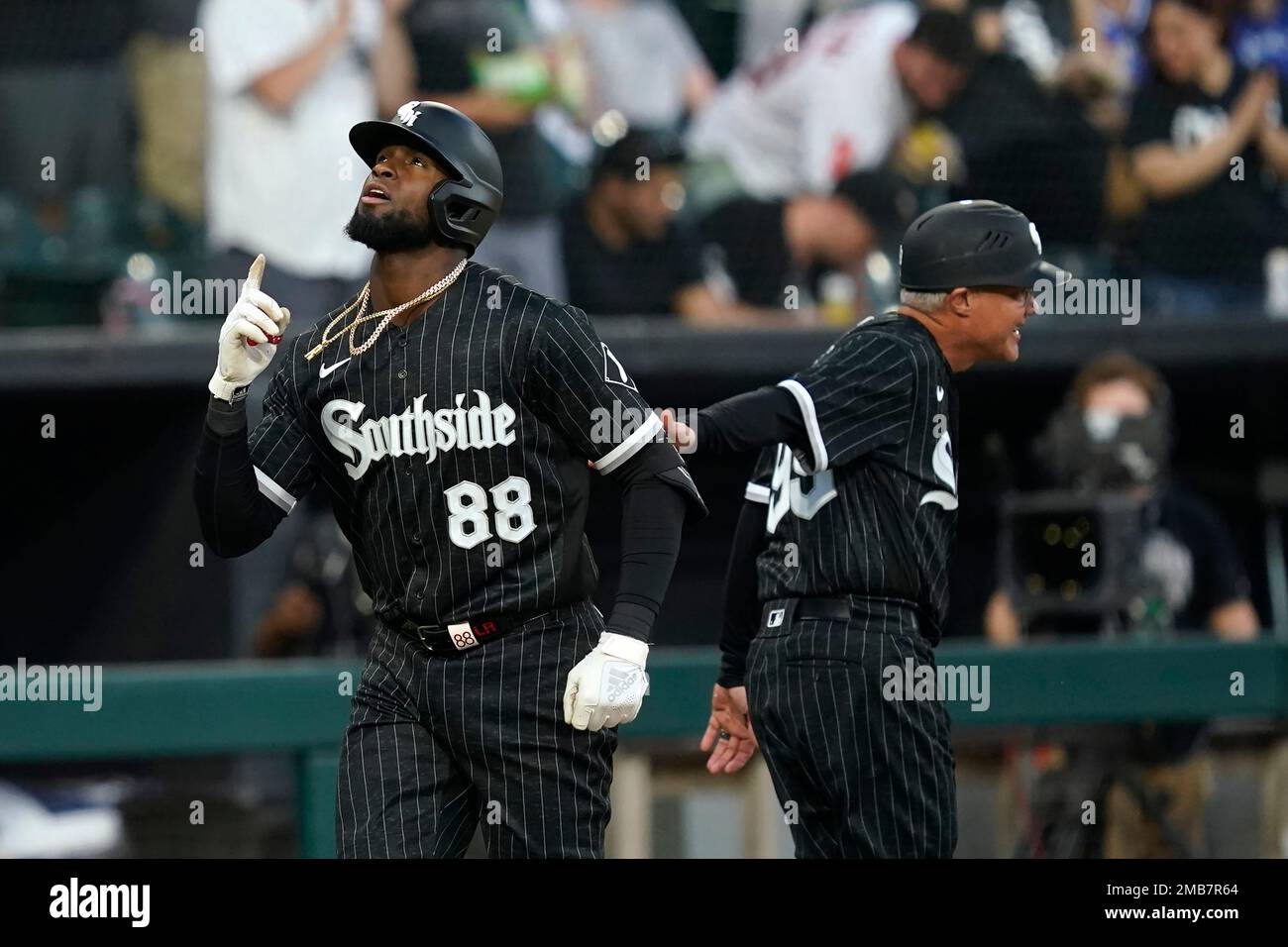 Chicago White Sox's Luis Robert passes third base coach Joe McEwing and  celebrates his two-run homer off Toronto Blue Jays starting pitcher Jose  Berrios during the third inning of a baseball game