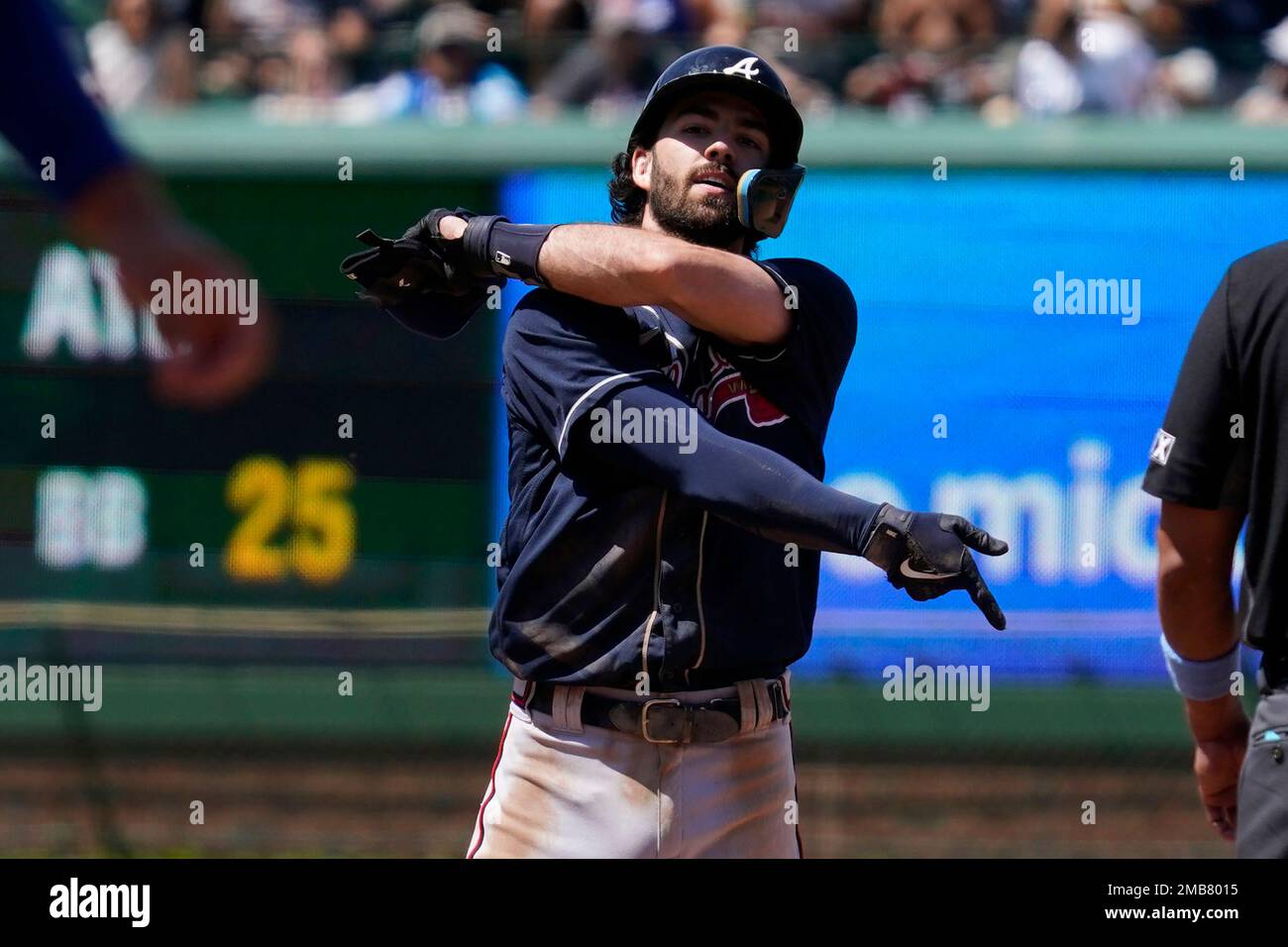 Atlanta Braves 'Dansby Swanson reacts in the dugout after hitting