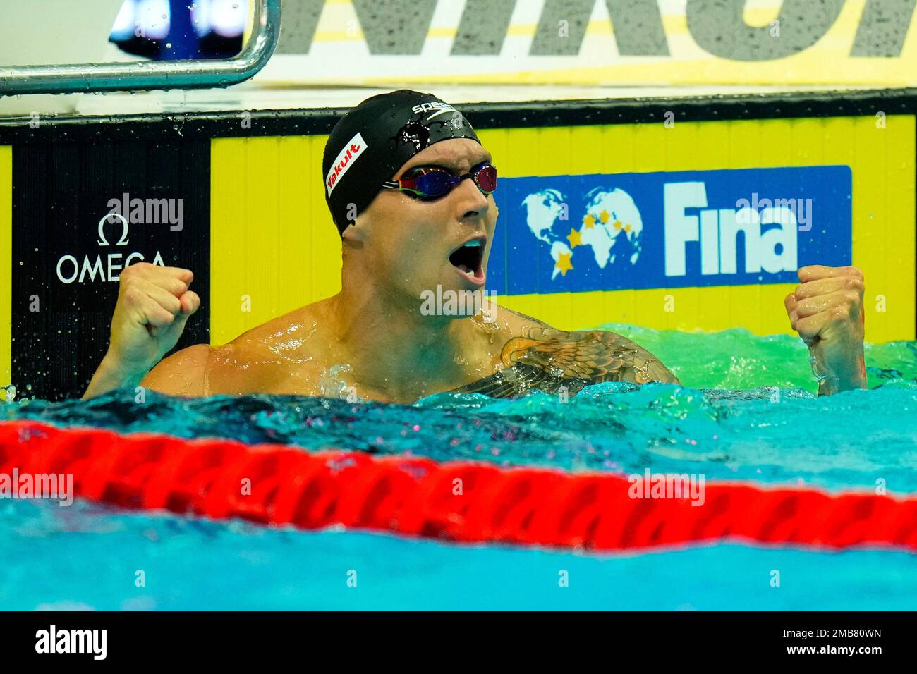 Caeleb Dressel of the United States celebrates after winning the Men ...